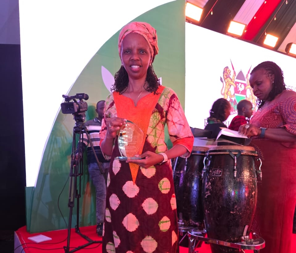 CEO with the award trophy