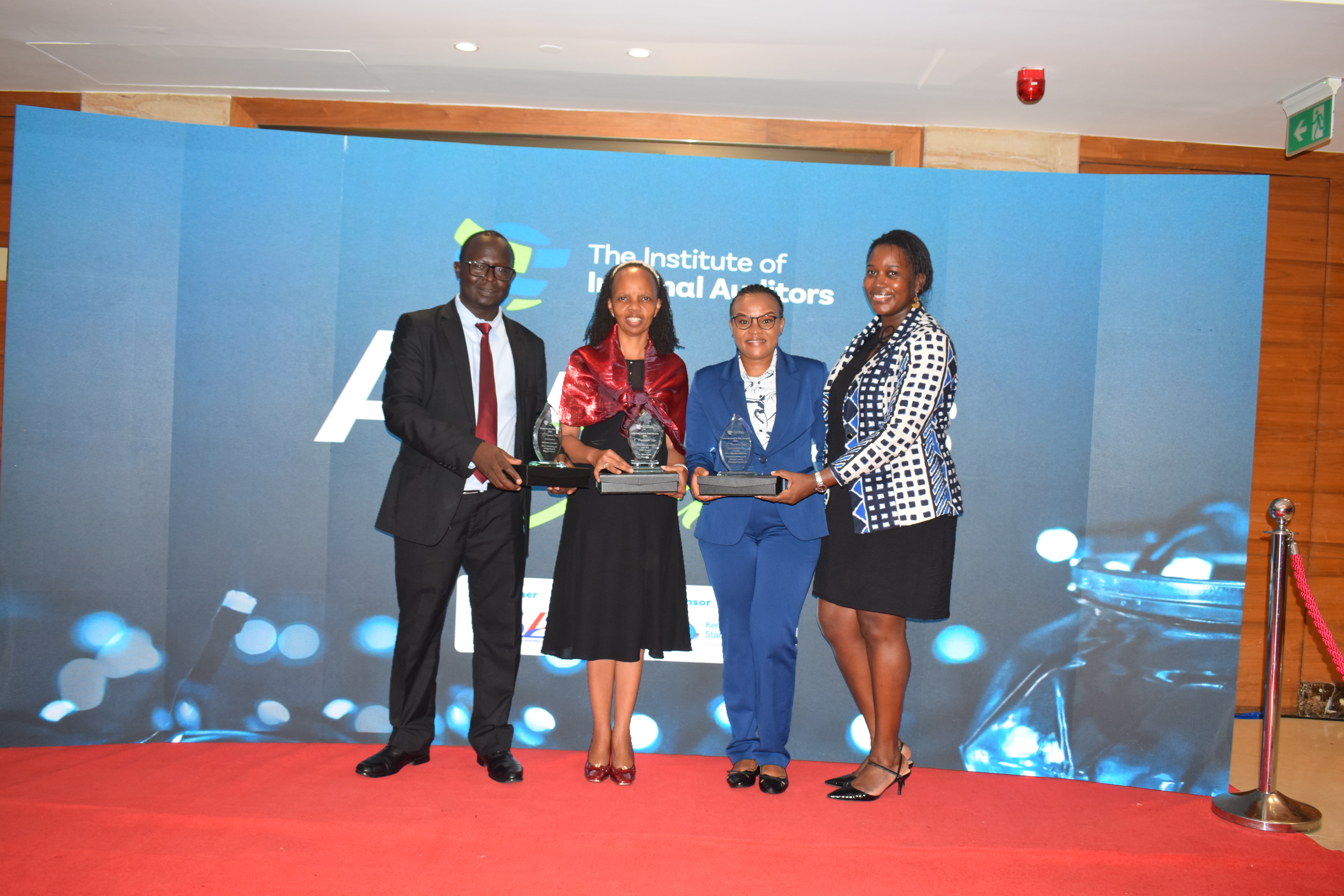 CEO group photo with trophies