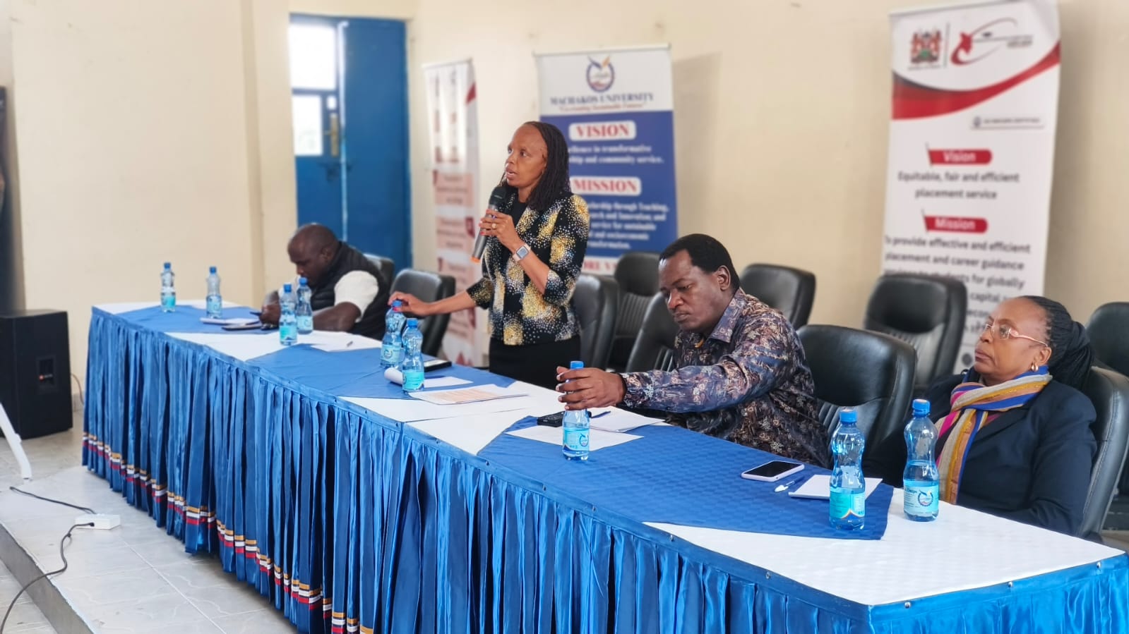 KUCCPS CEO and other staff at a panel discussion