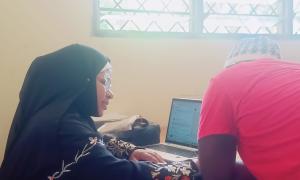 A KUCCPS officer explaining the application process at Msambweni TVC on 22/5/2025.