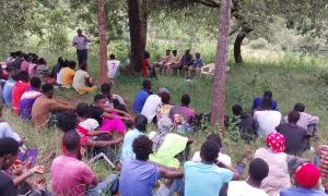 At Ngiluni Location Chief's Camp, Makueni County. Over 100 participants were present.