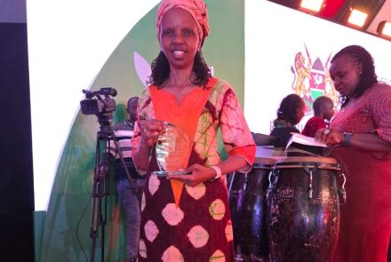 CEO with the award trophy